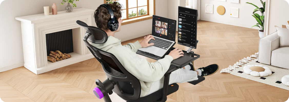 ergonomic workspace with LUMBO chair and electric desk – correct posture and equipment setup