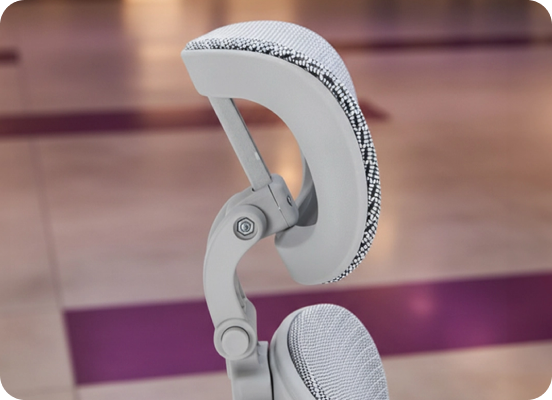 Modern ergonomic chair for working at home with an adjustable headrest and lumbar support in a stylish office